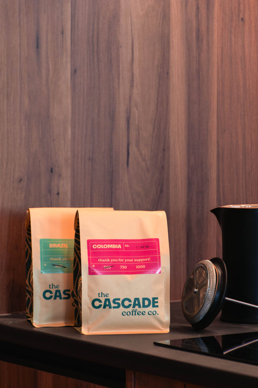Cascade Coffee beans displayed beside a grinder — premium office coffee supplier in New Zealand.